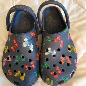 Size 7 navy crocs with butterfly design